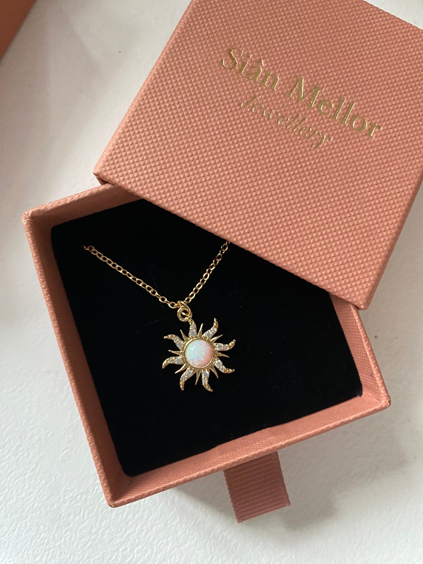 White sun necklace